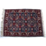 Eastern rug of blue ground with foliate designs and fringed edges, 165cm x 118cmCondition report: