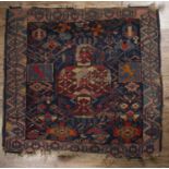Caucasian blue ground rug with stylised geometric designs, and heraldic 'lion passant' panels to