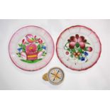 Two faience plates French circa 1820 and a little tas de vin, the plates decorated to the centre