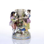 Meissen family group depicting husband and wife standing next to a pastille burner, with a child