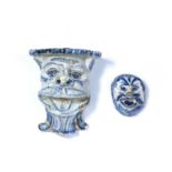 Two Delft blue and white glazed wall mounts/brackets 17th/18th Century, each modelled as a head, 8cm