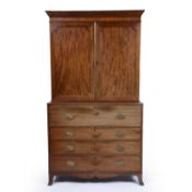 Mahogany secretaire bookcase early 19th Century, the top with panelled doors, fitted writing