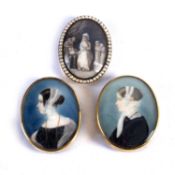 Two portrait miniatures and one other Georgian miniature in gilt metal mounts, all unsigned, the