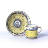 Sevres yellow ground coffee can and saucer French, circa 1800, painted en grisaille with an