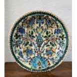 Iznik dish Persian, decorated in blue, turquoise, manganese, turquoise, green and black outline on a