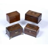 Group of four mahogany tea caddies 19th Century, one with brass mounts and handle, 23cm