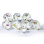 Set of eight Meissen coffee cups and seven saucers each painted with butterflies and individual