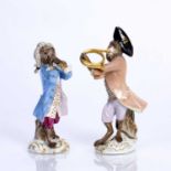 Two Meissen monkey orchestra figures to include the French horn player and a Trumpeter, both with