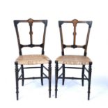 Pair of Aesthetic ebonised salon chairs 19th Century, with amboyna inlay, 40cm wide x 85cm