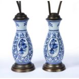 Pair of Delft pottery lamp bases with brass mounts, 53cm (excluding shades)Condition report: Light