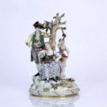 Meissen figure group modelled as a courting couple beneath an apple tree, standing on an oval