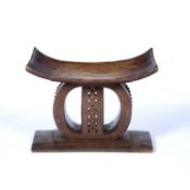 Ashanti stool with carved centre and rectangular base, 54cm x 27cm x 48cmCondition report: Chip to