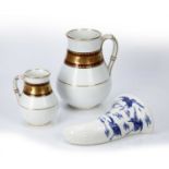 Christopher Dresser for Minton two graduated jugs and a wall pocket, the jugs with a border design