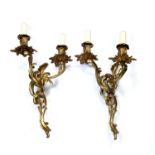 Pair of gilt metal two branch wall lights of asymmetric Rococo form, 37cm highCondition report: