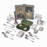 Collection of silver to include: toast racks, vesta case, condiment pot with blue glass liner,