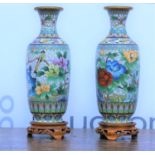 Pair of white cloisonne enamel vases 20th Century, with floral decoration on open fret carved wooden