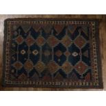 Hamadan blue ground rug with panels of stylised designs, within a geometric border, 177cm x