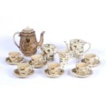 A late 19th Century Japanese pottery part tea service, painted and gilt decorated with insects,