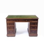 A Victorian mahogany pedestal desk, the top with morocco leather inset above one long and eight