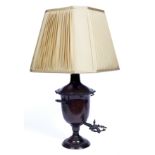 A Continental lacquered metal samovar converted to a table lamp with tap and shade, on a circular
