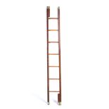 A seven rung folding library pole ladder c1975 by Arthur Brett and Sons with outer brass studded