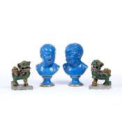 A pair of 19th century blue glazed porcelain busts, of babies, on gilt heightened socle bases,