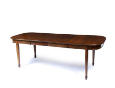 An early 20th century extending 'D' end dining table, of narrow proportions extending via a handle