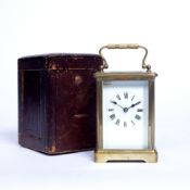 A 19th century French brass carriage timepiece, with white enamel dial, on bracket feet, 11.5cm