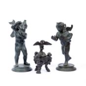 After Fernando de Luca, a bronze figure of a winged cherub holding a dolphin and companion figure of