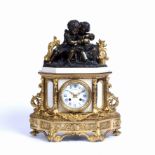 Martin Baskett et Cie, Paris Clockmaker. An ormolu and white marble mantel clock, the enamel dial