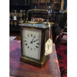 A French brass repeater carriage clock with white enamel dial, 14cm high