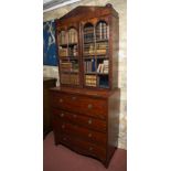 A George III mahogany secretaire chest, the secretaire drawer enclosing open shelving and above
