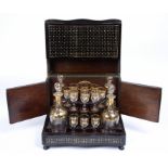 A late 19th century French gilded glass liqueur set, sixteen small baluster glasses and four