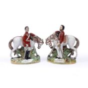 A pair of Staffordshire pottery figures, of Garibaldi & Napier, each standing beside a grey horse,