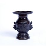 A Japanese bronze small baluster vase with raised bird decoration and flared neck, 12.5cm high