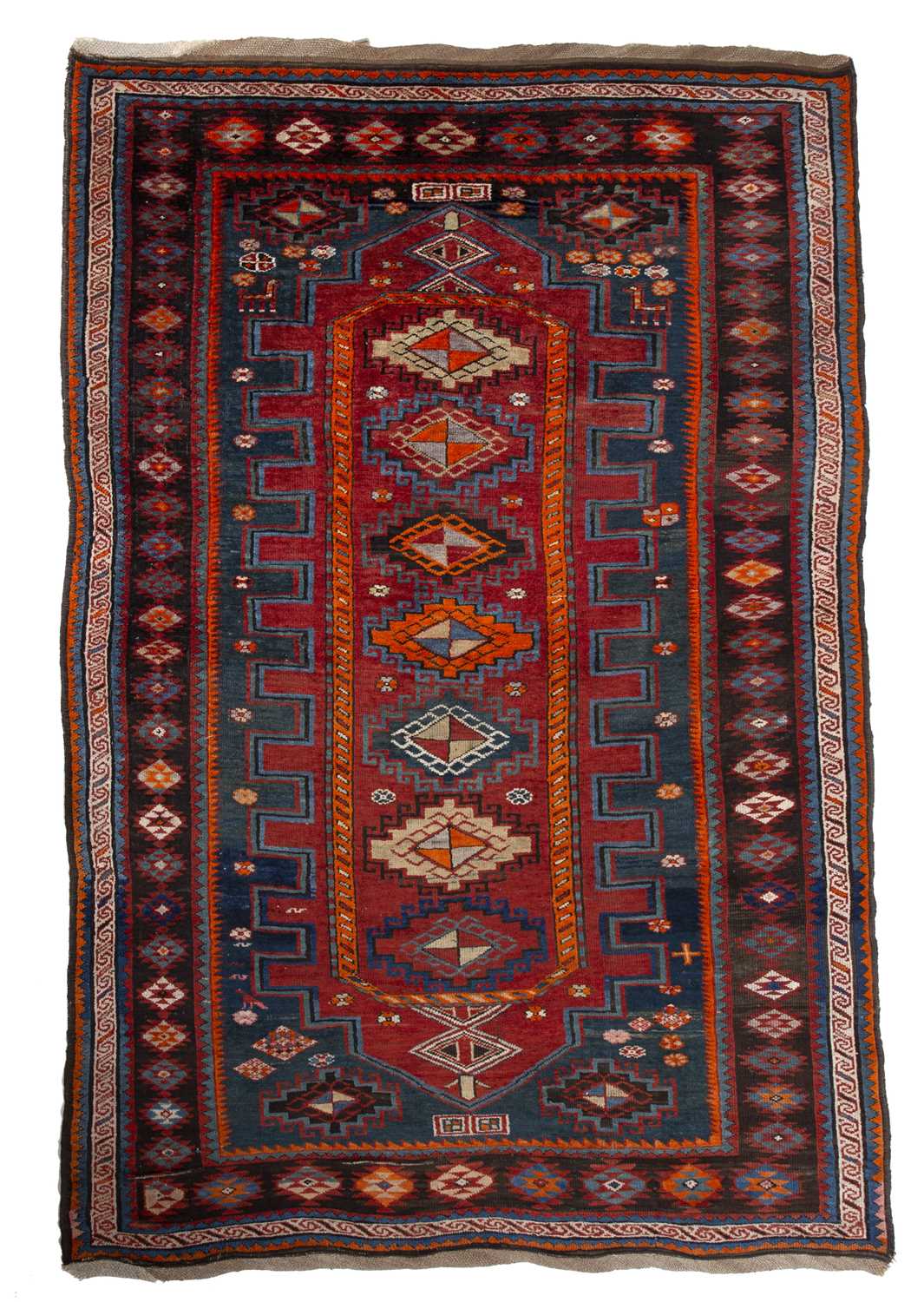 A Kasak polychrome rug with six central hooked medallions within a multiple border, 253 x 156cm
