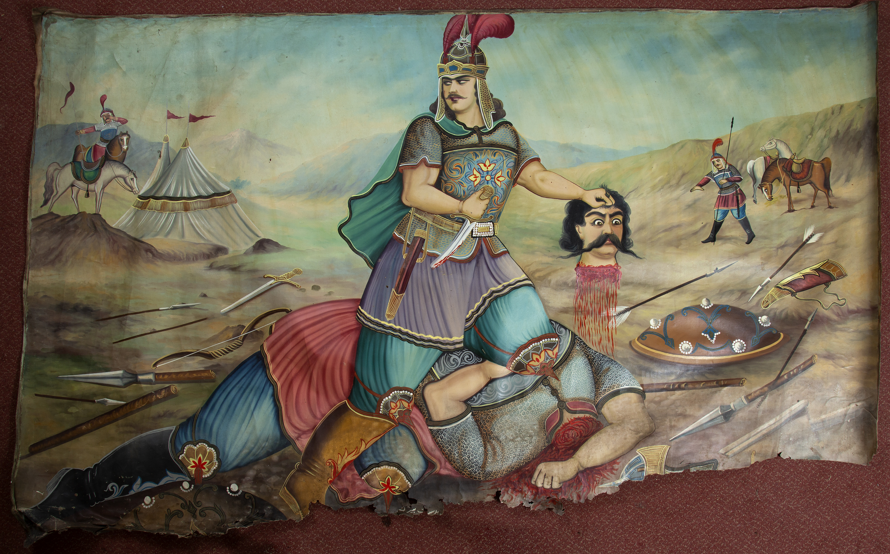 A large 19th century Middle Eastern oil painting depicting a battle scene with graphic detail and