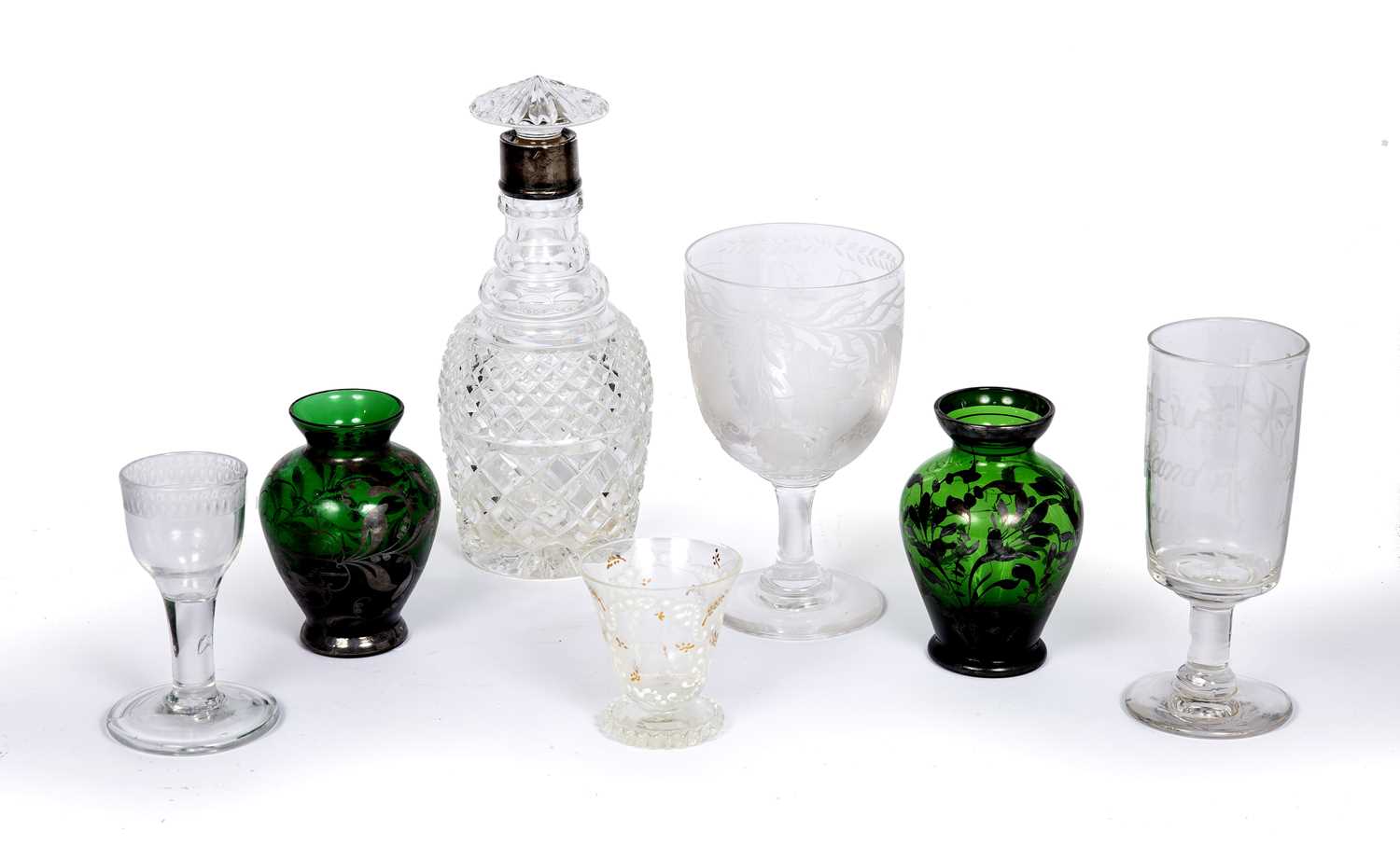 A group of seven pieces of Antique glass to include a silver mounted decanter with mushroom stopper,