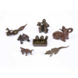 A bronze miniature figure of a recumbent ram, together with a collection of further animals