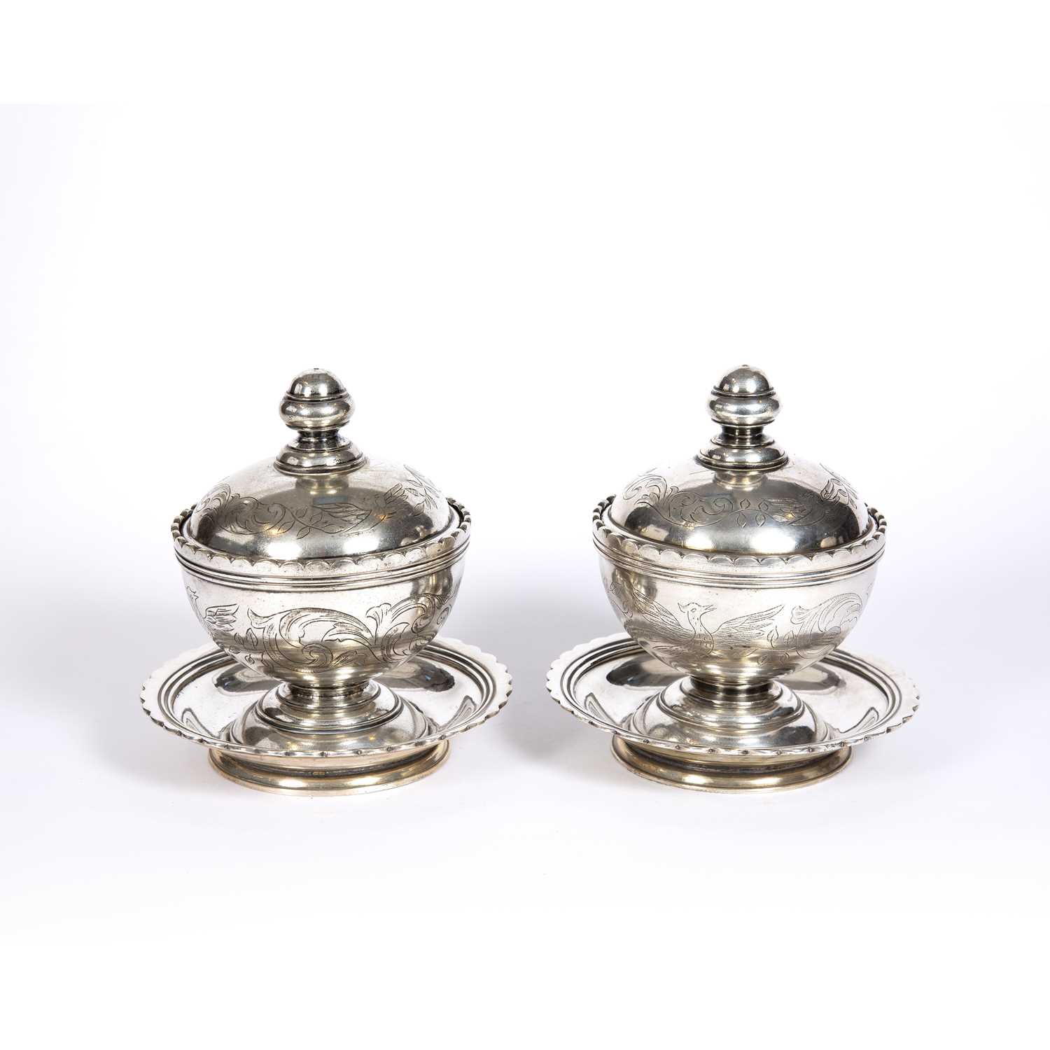 A pair of late 18th / early 19th Century Islamic silvered sweetmeat dishes, lidded cover and bowls