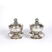 A pair of late 18th / early 19th Century Islamic silvered sweetmeat dishes, lidded cover and bowls