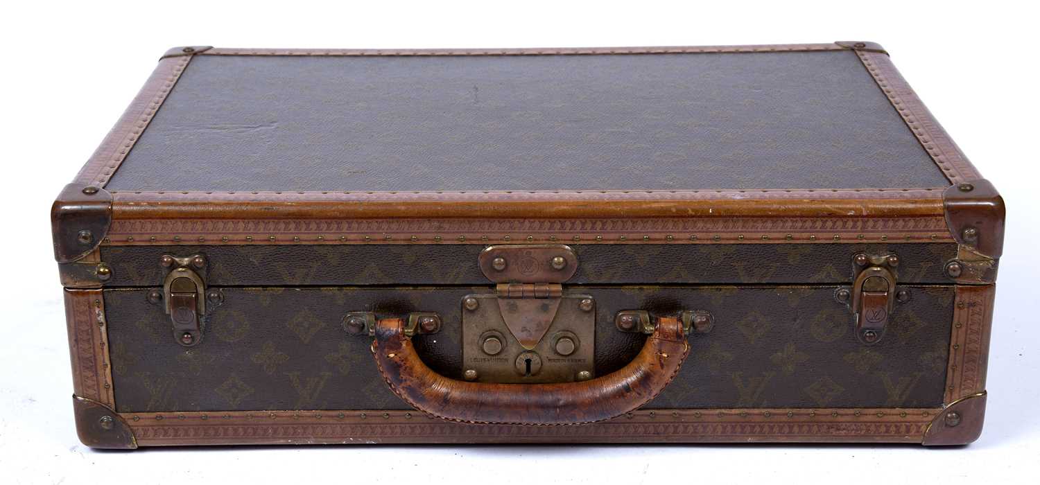 A vintage Louis Vuitton monogram small suitcase, with stamped brass lock and clasps, label to the - Image 5 of 5