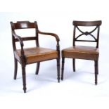 A set of six George III mahogany dining chairs each with an 'X' frame back, studded and