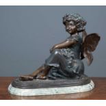 A large early 20th century bronze seated figure of a fairy holding a bunch of flowers, signed F.