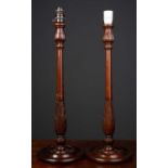 A pair of turned mahogany table lamps each 57cm in heightCondition report: Different fittings to the