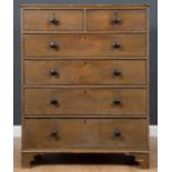 A Victorian pine green painted chest of two short and four long drawers with turned knob handles and