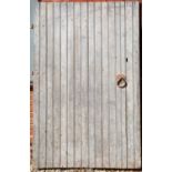 A large 19th century grey painted coach house door, the three hinge points on the left hand side and