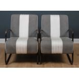A pair of Andrew Martin grey and white upholstered arm chairs, with black painted steel arms and