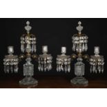 A pair of two branch cut glass Regency-style candelabras, the two branches and central raised finial