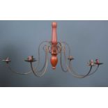 A shaker style six light chandelier with central turned wooden support with scrolling arms,